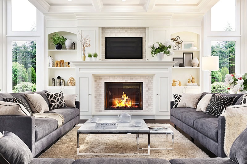 Luxurious interior designed living room and fireplace.